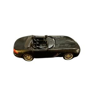 Stylish Black Convertible Toy Car with Gold Accents